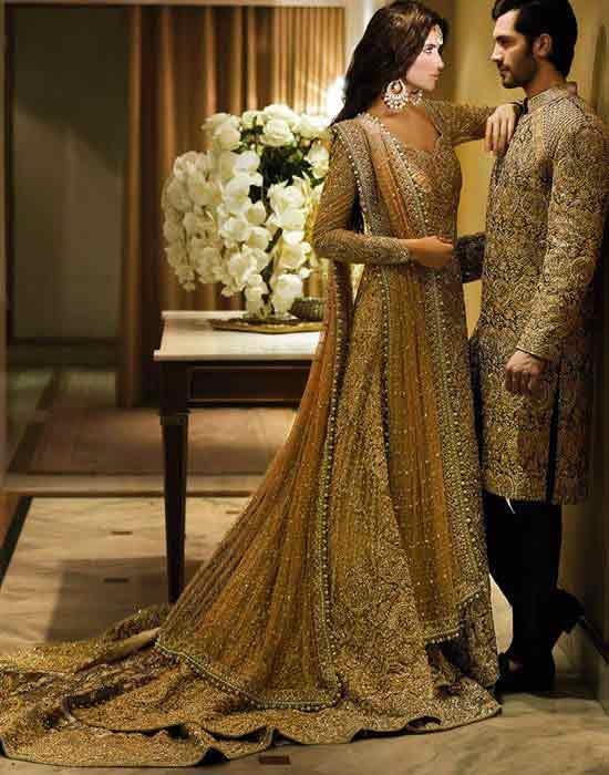 Bridal in mustard and golden long tail maxi shirt with lehnga and groom in matching sherwani with pajama latest indian and pakistani wedding matching dress combinations for bride and groom 2017 