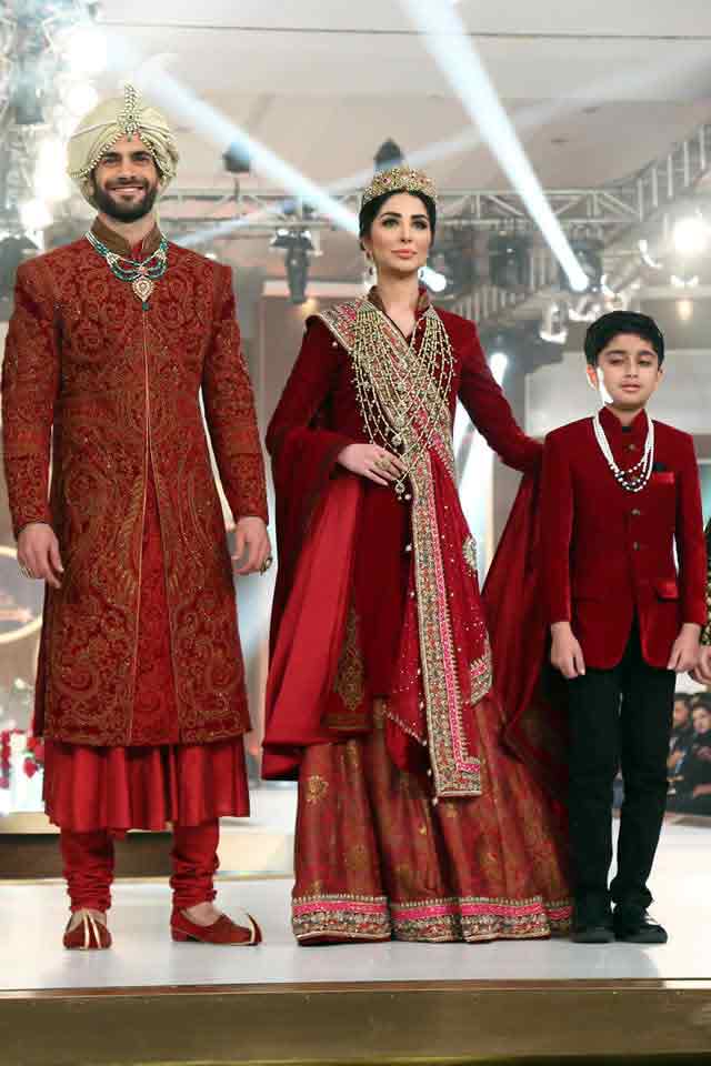 Bridal in traditional maroon long shirt with sharara and groom in matching sherwani with pajama trouser latest indian and pakistani wedding matching dress combinations for bride and groom 2017