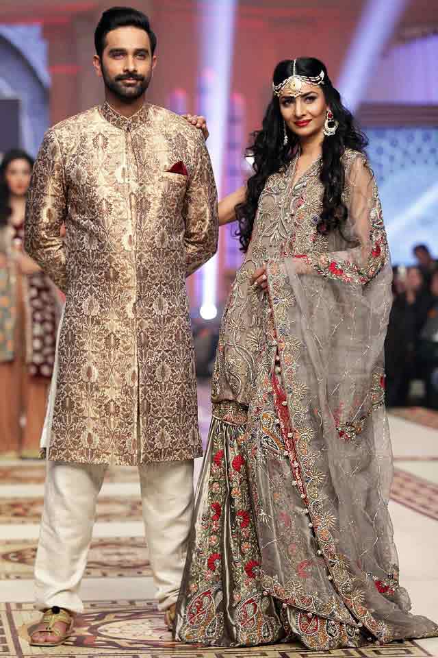 Bridal in classy ash grey dress with dupatta and groom in matching short sherwani with white pajama or trouser latest indian and pakistani wedding matching dress combinations for bride and groom 2017