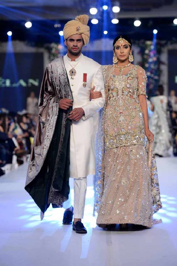 Bridal in heavily embroidered cream shirt with lehnga and groom in white sherwani with shawl latest indian and pakistani wedding matching dress combinations for bride and groom 2017