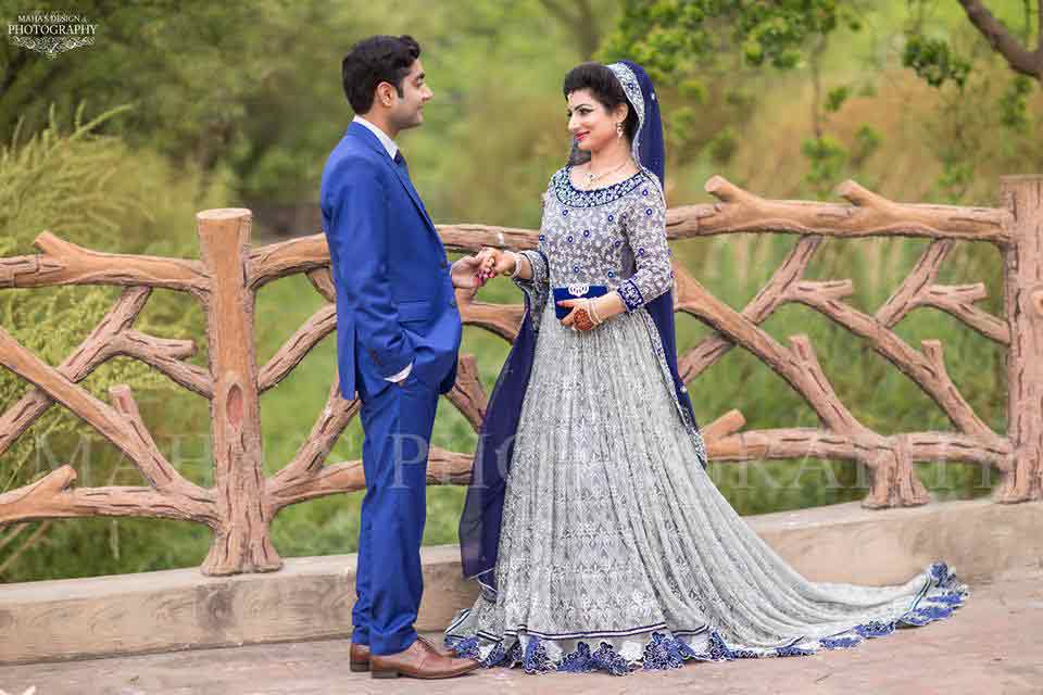 bridal in grey long tail frock with blue dupatta and groom in blue matching pant coat latest indian and pakistani wedding matching dress combinations for bride and groom 2017