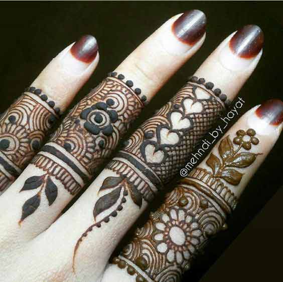 Intricate mehndi for fingers