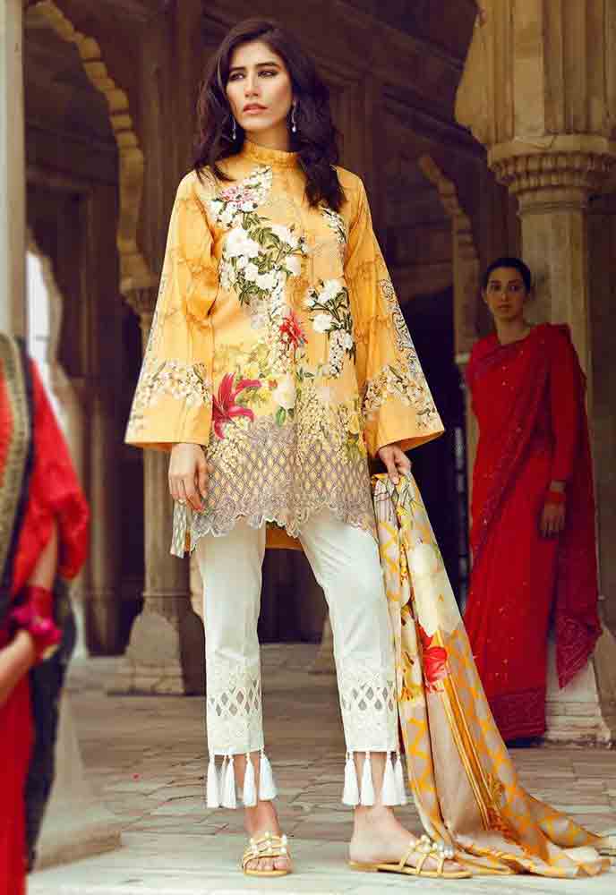 Cross Stitch yellow kurti with white capri new eid dress designs for girls in Pakistan 2017