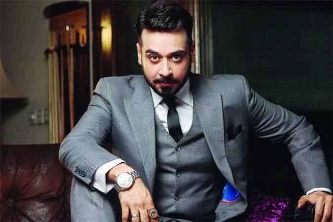 Faisal Qureshi in white shirt and black tie combinations with grey suits in Pakistan