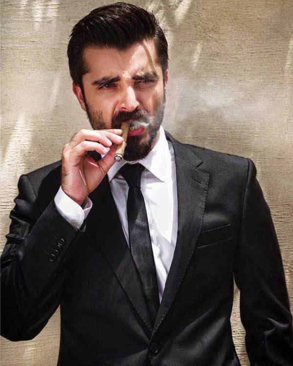 Hamza Ali Abbasi in white shirt and black tie combinations with black suits in Pakistan