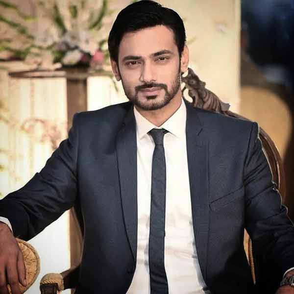 White shirt and black tie combinations with black suits in Pakistan