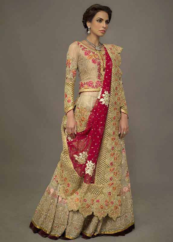 Heavily embroidered lehenga choli style Pakistani bridal dress in red and golden color combinations 2018