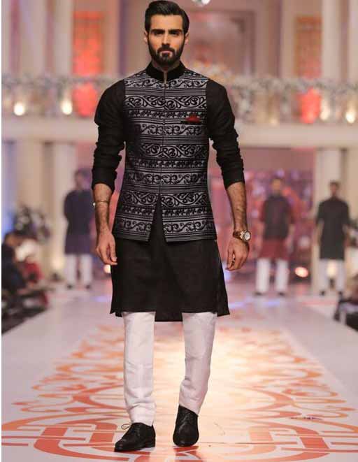 Latest black and white kurta pajama with waistcoat for grooms in Pakistan