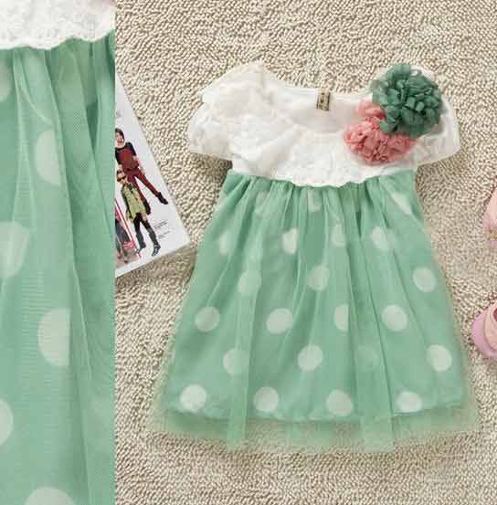 White and green baby frock with flower